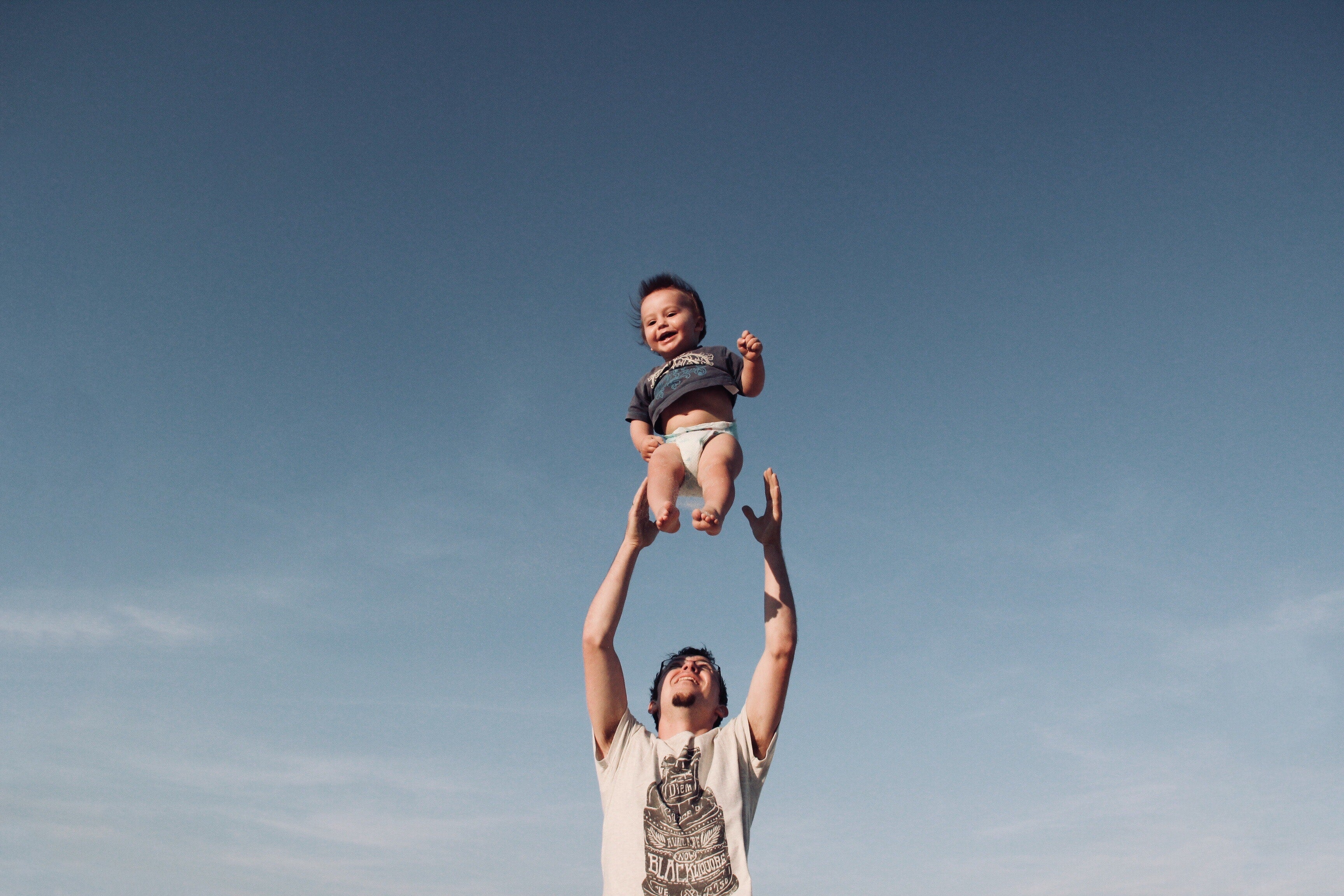 father playing with toddler